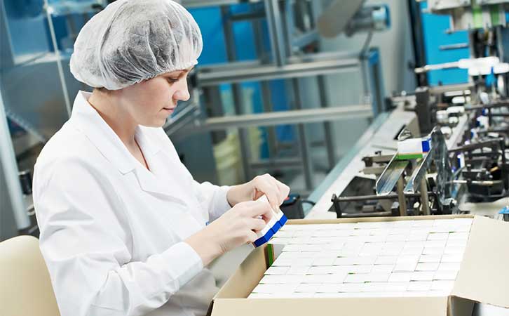 worker in pharmaceutical manufacturing