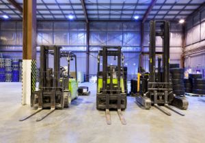 Forklifts in warehouse