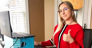 Ambrie sits at her home office