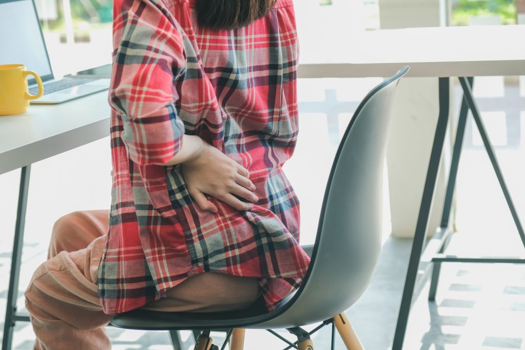 WFH back pain red plaid shirt