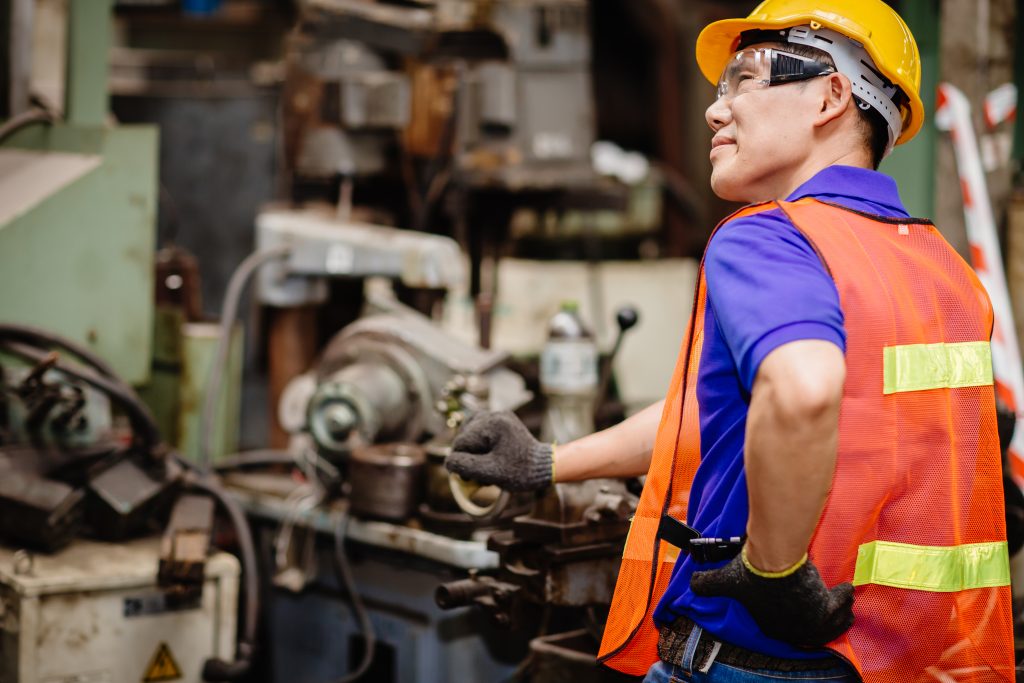 Worker with Back Pain Looking Confused